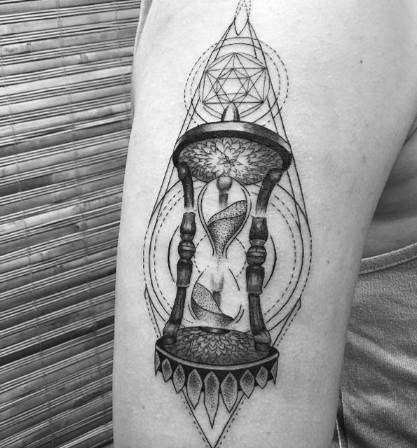 Dotwork hourglass tattoo by Ariel Nirakara