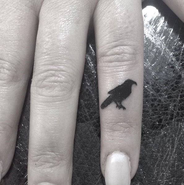 Crow finger tattoo by Oliver Whiting