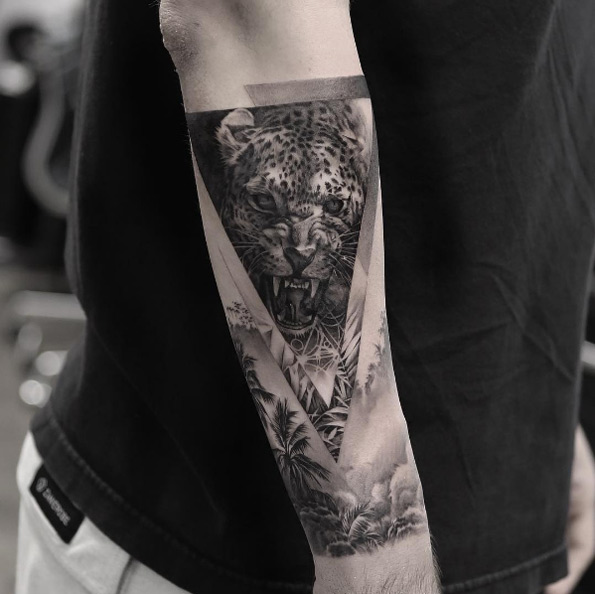 Jungle cat forearm tat by Oscar Akermo