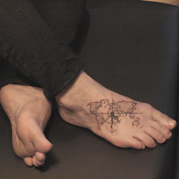 World map tattoo on foot by Lindsay April