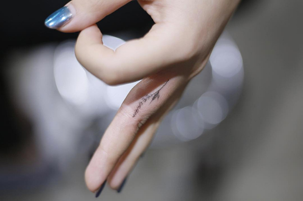 Floral finger tattoo by Tattooist Flower