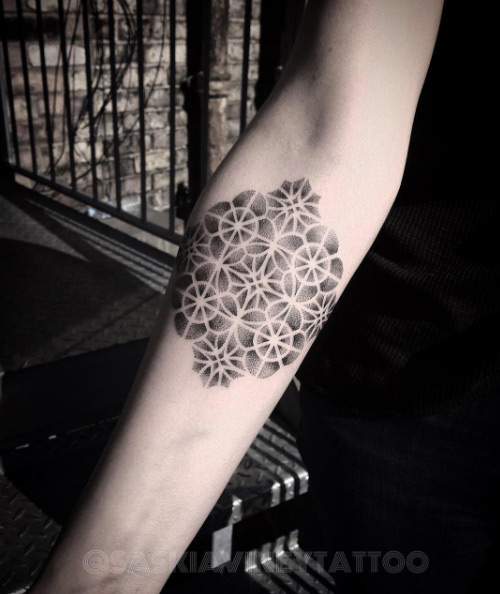 Dotwork sacred geometry tattoo by Saskia Viney