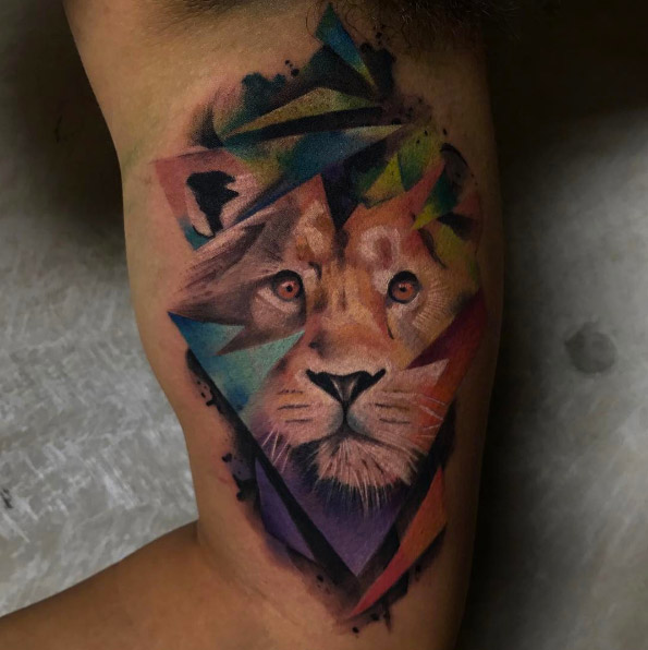 Colorful geometric lion tattoo by Armand Munoz