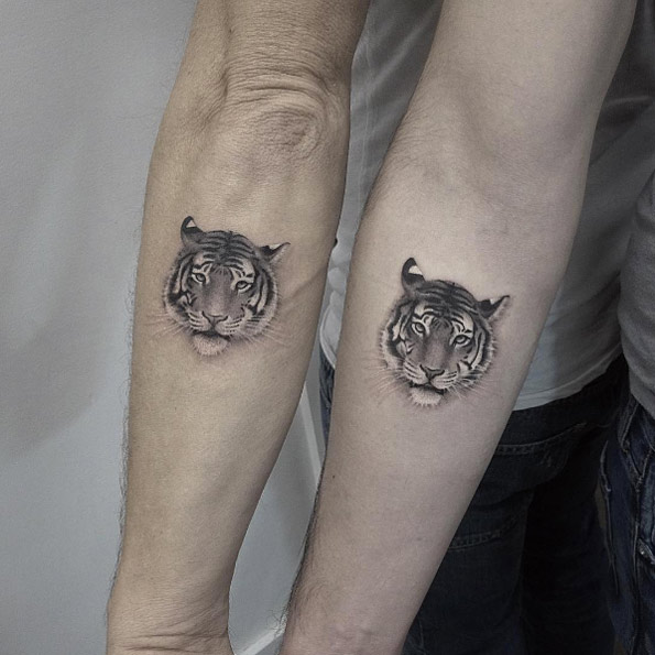 Matching tiger tattoos by Elizabeth Markov