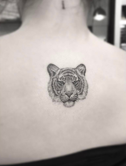 Tiny dotwork tiger tattoo on back by Doctor Woo
