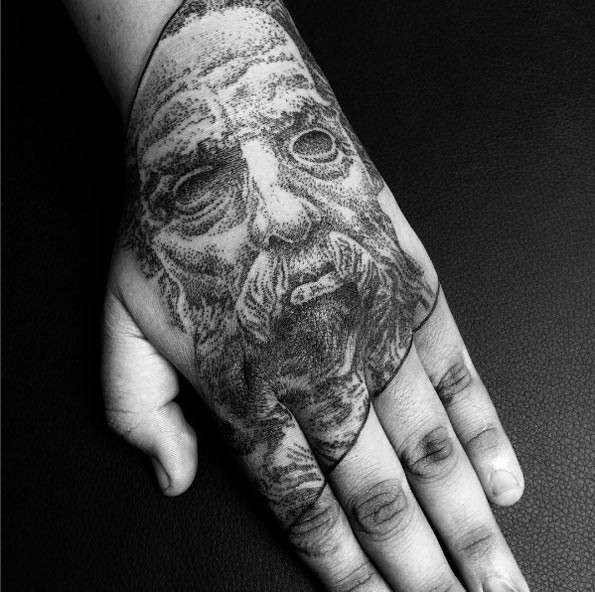 Dotowork portrait tattoo on hand by Mathieu Kes