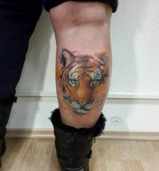Watercolor tiger tattoo on calf by Anton