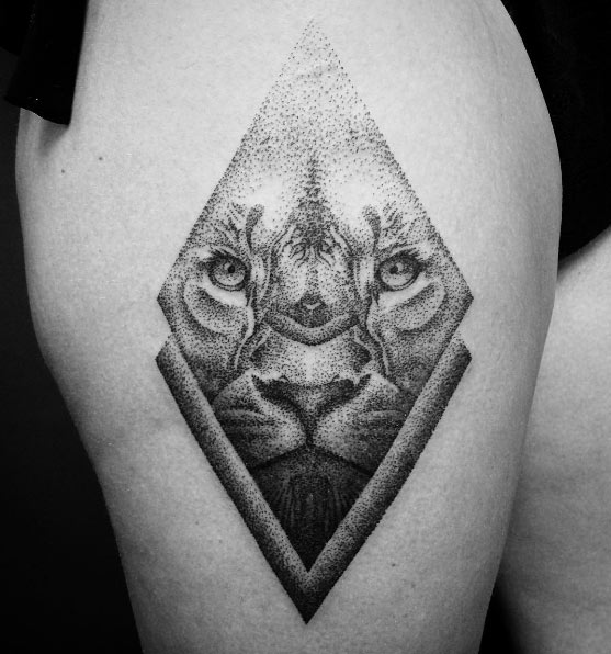 Diamond-shaped lion tattoo by Mathieu Kes