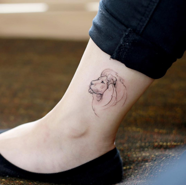 Elegant lion tattoo on ankle by Tattooist Doy