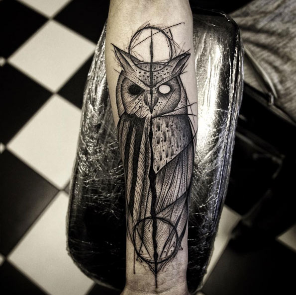 Split design owl tattoo by Damo