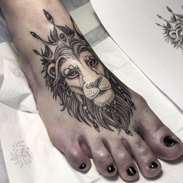 Lion tattoo on foot by Kristina Darmaeva