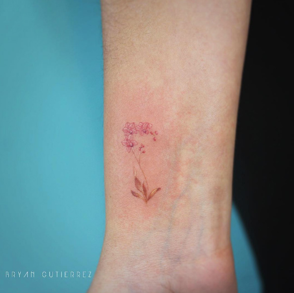 Pink orchids on wrist by Bryan Gutierrez