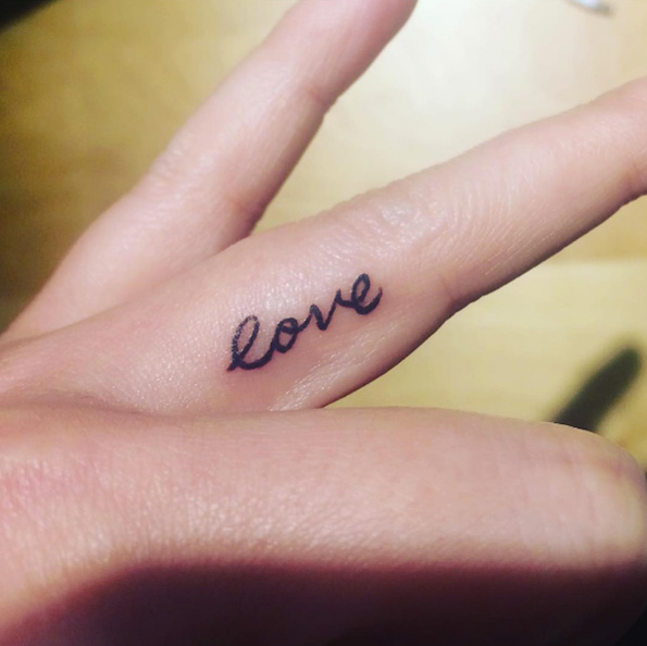 'Love' finger tattoo via Erika