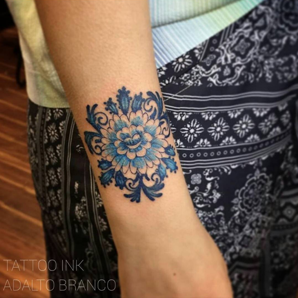 Blue ink floral ornament by Estudio de Tattoo