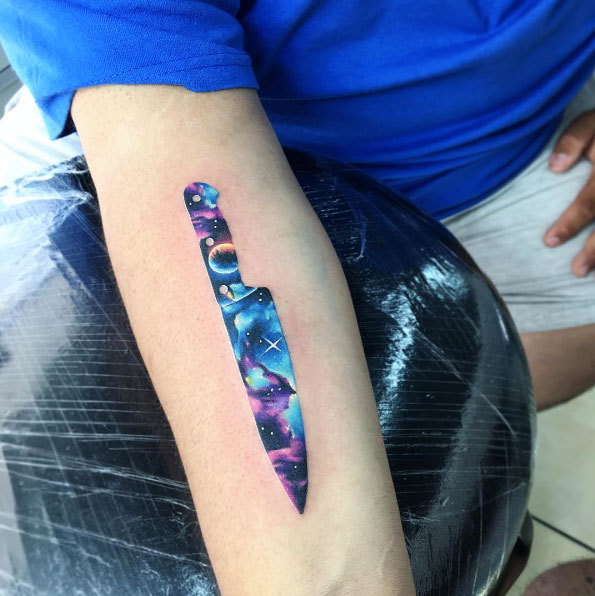Amazing galaxy knife tattoo design by Adrian Bascur