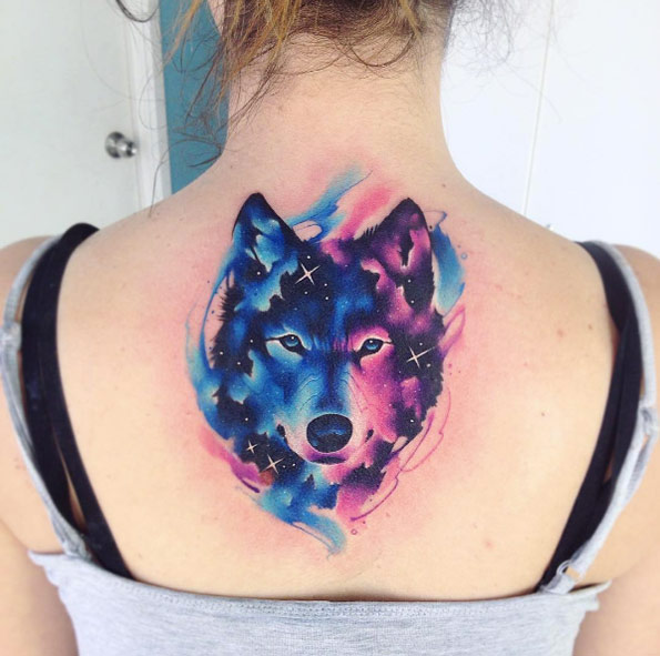 Galaxy wolf tattoo on back by Adrian Bascur