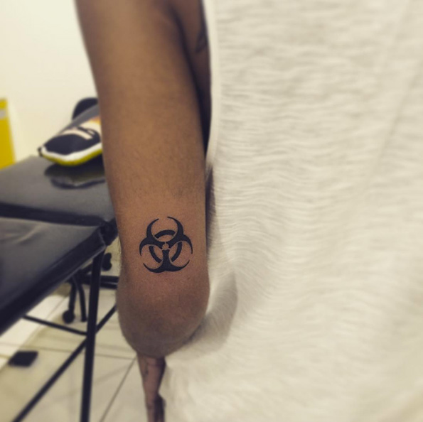 Biohazard symbol tattoo by Iara Oliver