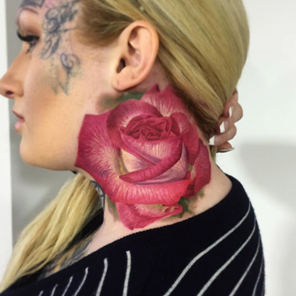 Large rose tattoo on neck by Rafal Makarow