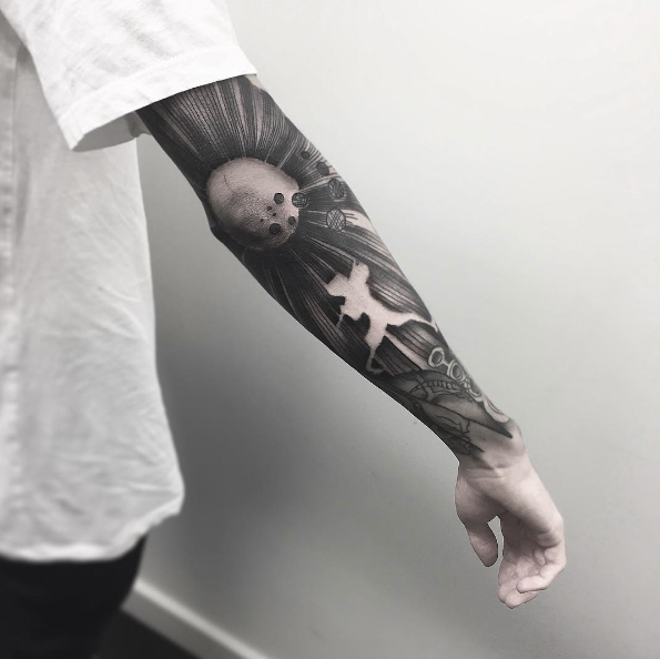 Radiating sleeve tattoo by Kev Richardson