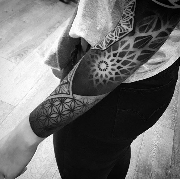 Dynamic full sleeve tattoo by Wagner Basei