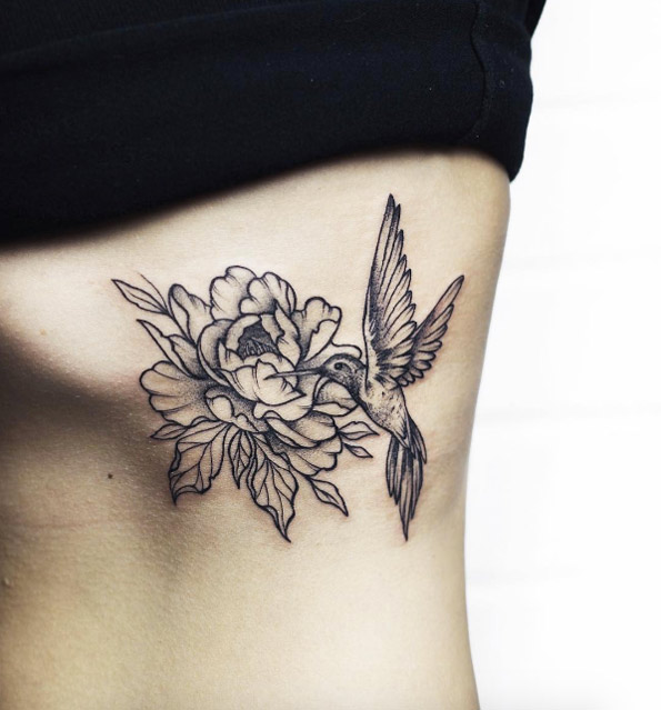 Hummingbird tattoo on side by Anastasia Martynova