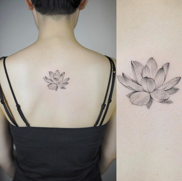 Lotus flower tattoo by Nando