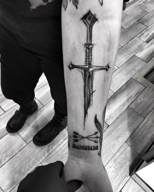 Sketch style sword tattoo by Inez Janiak
