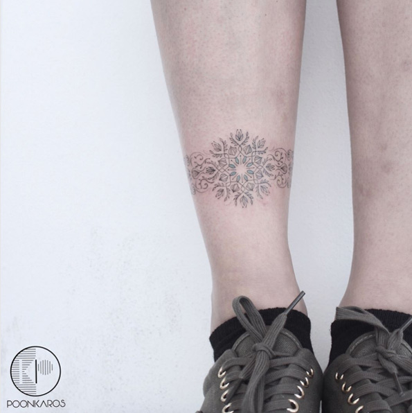 Intricate legband tattoo by Karry Ka-Ying Poon