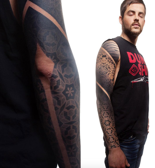 Spiraling sleeve tattoo by Ervand Akopov