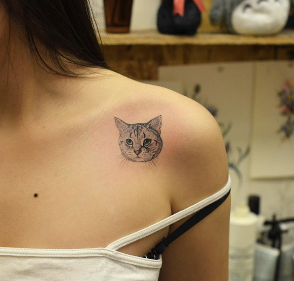 Cat tattoo by Tattooist Grain