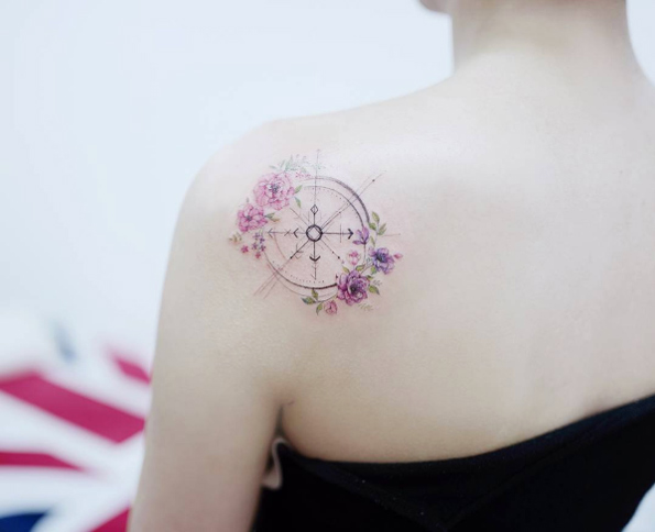 Floral compass tattoo on back shoulder by Tattooist Banul