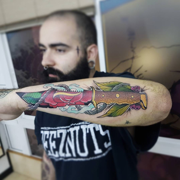 Colorful knife tattoo by Angel Onze