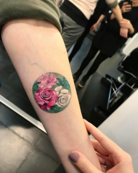 Circular floral tattoo by Eva Krbdk