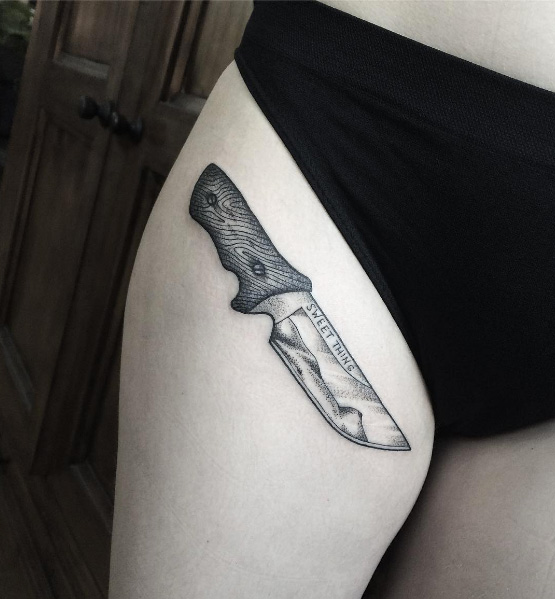 Knife tattoo on thigh by Lillian Elizabeth