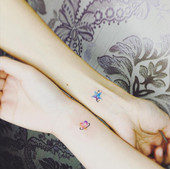 Matching star and heart tattoos by Suantsai