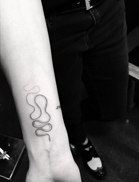 Snake skeleton tattoo by Doctor Woo