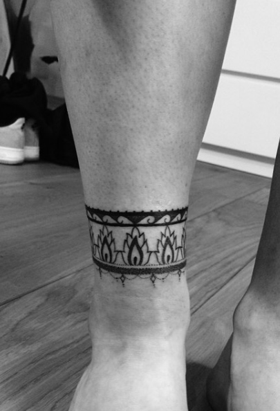 Ankle cuff tattoo by Amber