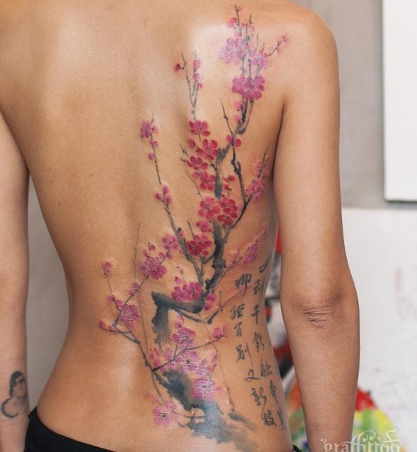 Large cherry blossom tattoo on back by Tattooist River