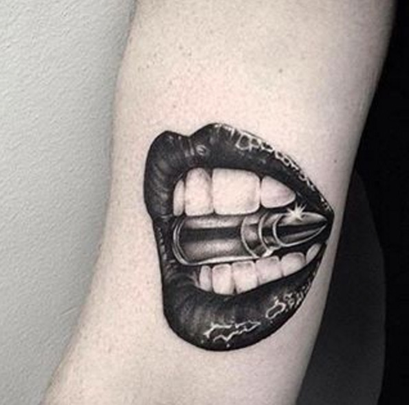 Bullet between teeth tattoo by Ryan James