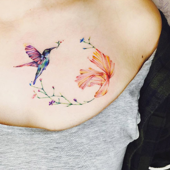 Hummingbird and koi fish tattoo by There Tattoo