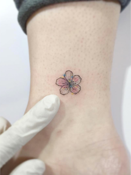 Mini cherry blossom tattoo by Playground Tattoo