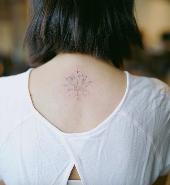 Elegant lotus flower tattoo by Nando