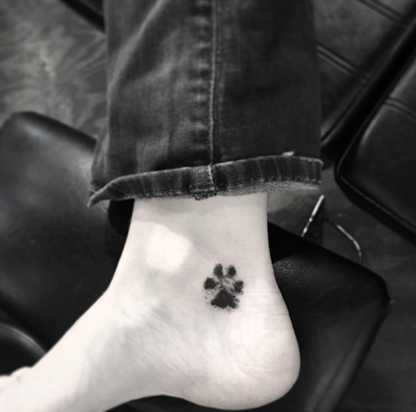Paw print tattoo on ankle by OK
