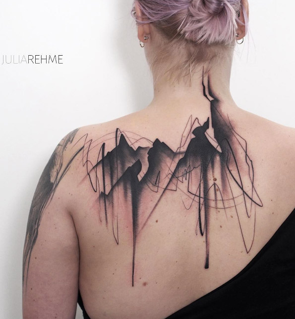 Large mountain tattoo on back by Julia Rehme