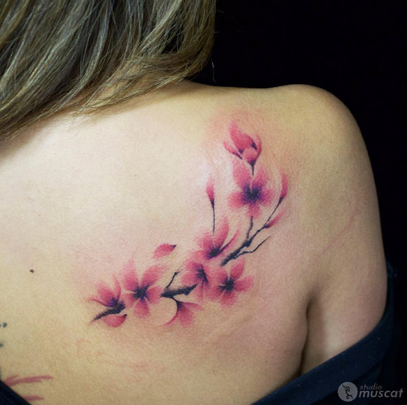 Cherry blossom tattoo on back shoulder by Eiji