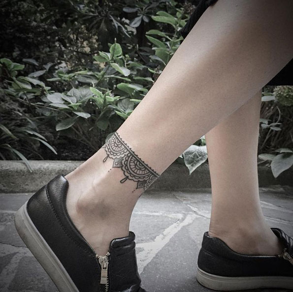 Beautiful ornamental anklet tattoo