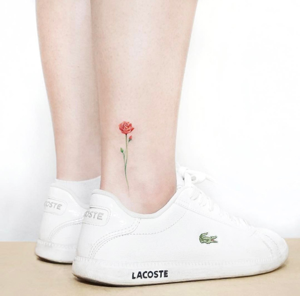 Single rose tattoo on ankle by Heejae Jung