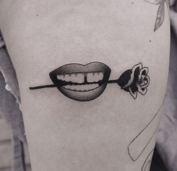 Rose in mouth tattoo by Brendon