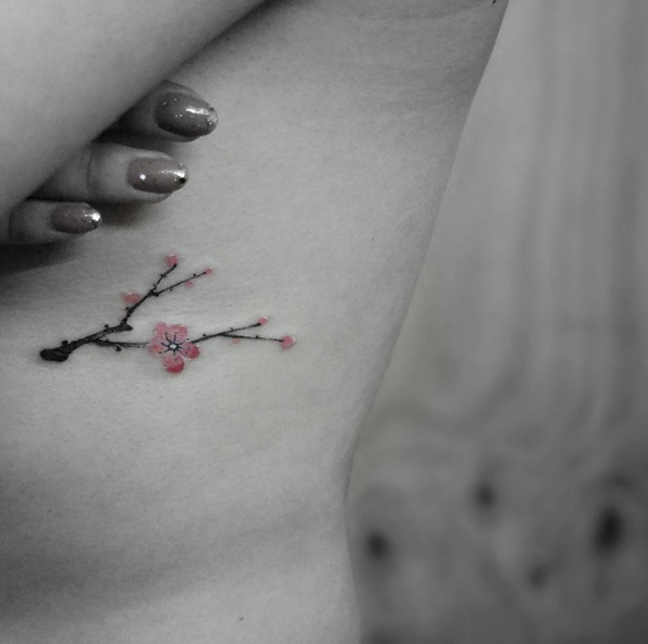 Oriental cherry blossom tattoo by Tattoo With Me