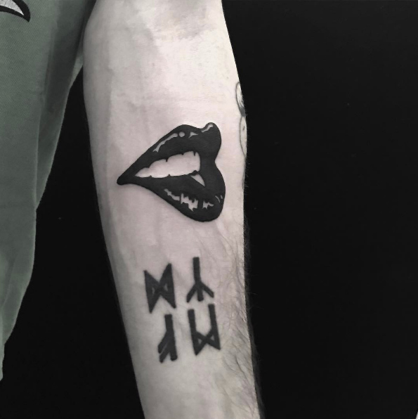 Lip bite tattoo by Johnny Gloom
